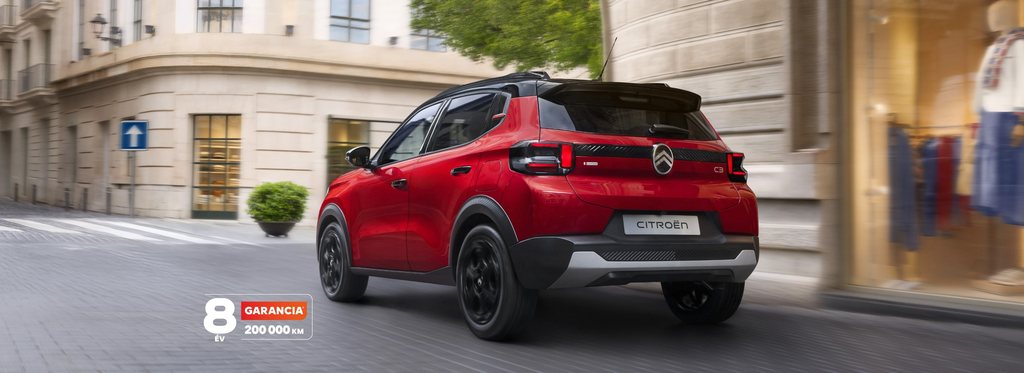 Side driving view of Citroën C3 compact SUV highlighting smooth urban performance and 8‑year warranty for confident, affordable mobility.